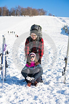 Couple with skiing equipment on snowy mountain