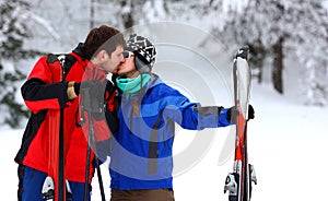 Couple on a skiing holiday kissing