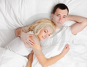 Couple sleeping in a bed