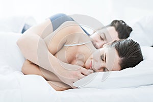 Couple sleeping in bed