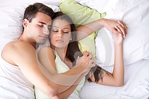 Couple sleeping on the bed