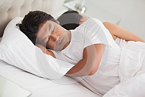 Couple sleeping in bed