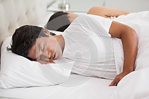 Couple sleeping in bed