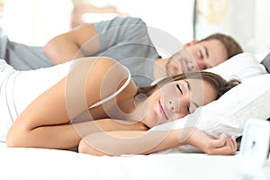 Couple sleeping in a comfortable bed