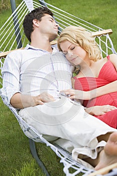 Couple sleeping in hammock