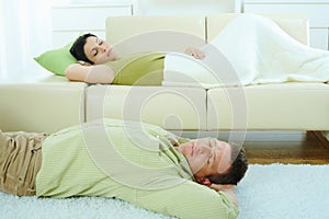 Couple sleeping at home
