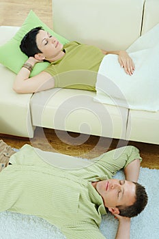 Couple sleeping at home