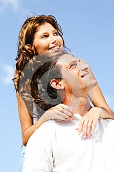 Couple smiling and looking away