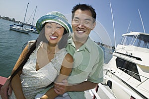 Couple smiling at marina (portrait)