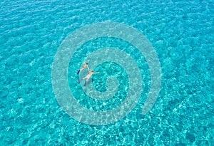 Couple is snorkeling in the Aegean Sea in Greece