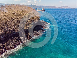 Couple snorkeling in the blue sea ocean and coral background aerial top view