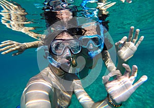 Couple snorkeling in Maldives