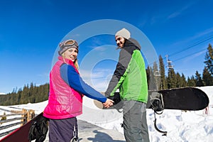 Couple With Snowboard And Ski Resort Snow Winter Mountain Smiling Man Woman