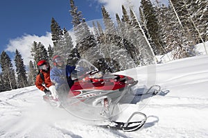 Couple On Snowmobile