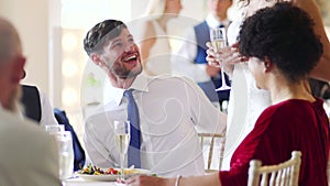 Couple Socialising At Their Wedding