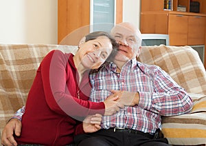 Couple on sofa in home