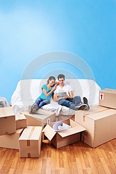 Couple on sofa moving