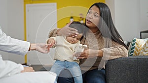 Couple and son having medical consultation at clinic