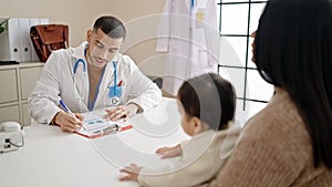 Couple and son having medical consultation at clinic