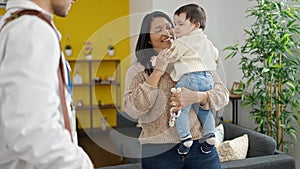 Couple and son smiling confident having medical consultation at clinic