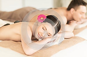 Couple in spa with hot stones