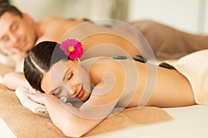 Couple in spa with hot stones