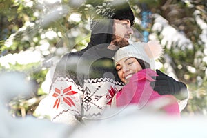 Couple spending quality time with each other in winter forest