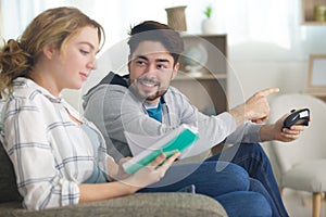 Couple spending time on sofa