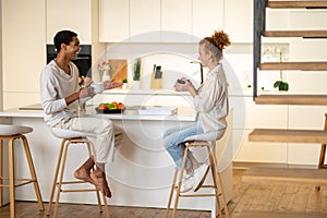 Couple spending time together and having breakfast in the kitchen