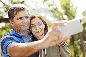 Couple spending time together taking a picture from mobile phone