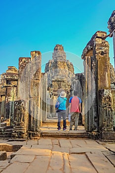 Couple stand infront of bayon temple siem reap cambodia