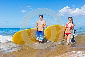 Couple with Stand Up Paddle Boards