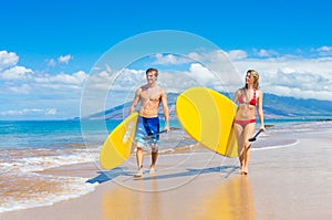 Couple Stand Up Paddle Surfing In Hawaii