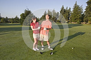 Couple Standing on Golf Course - Horizontal