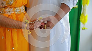 Couple standing together. Woman dressed in traditional Indian hindu wedding.. Close up