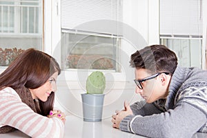 Couple staring at each other across the table