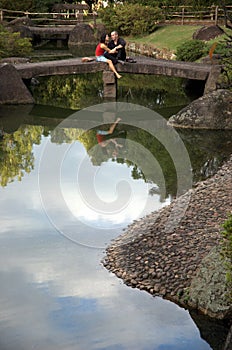 Couple on stone bridge