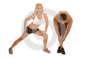Couple stretch together her lunge