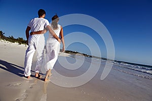 Couple strolling on beach