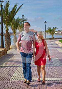 Couple Strolling on Promenade