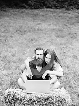 Couple of student and girl study on laptop on grass