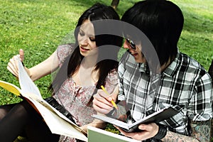 Couple studying outdoors