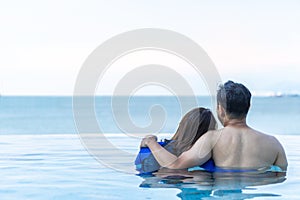 Couple summer holiday travel vacation lifestyle with happy man and woman relaxing together having good time in resort