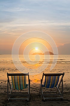 Couple of sun loungers on the beach.