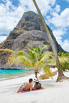 couple sunbathing on the beach summer vacation sunny day tropical Island of Saint Lucia Caribbean