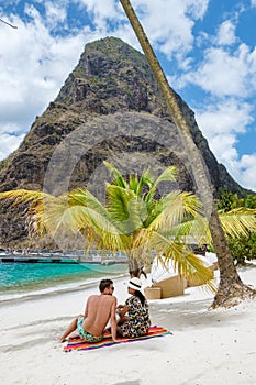 couple sunbathing on the beach summer vacation sunny day tropical Island of Saint Lucia Caribbean