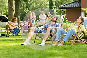 Couple sunbathing in the garden