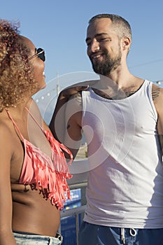 Couple on sunny beach in summer vacation