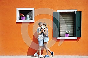 Couple in a sunny day in Burano, Venice, Italy