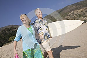 Couple with surfboard